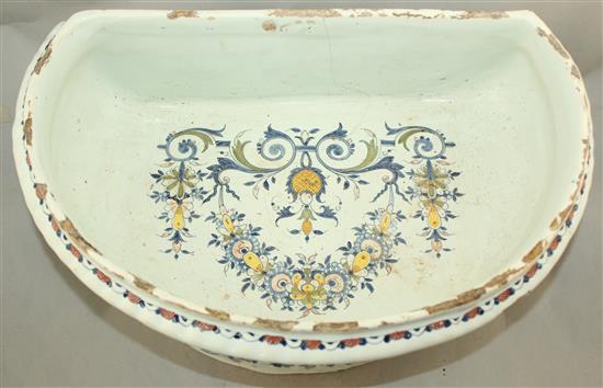 A Rouen faience pottery cistern, c.1720-1740, 53cm, restored